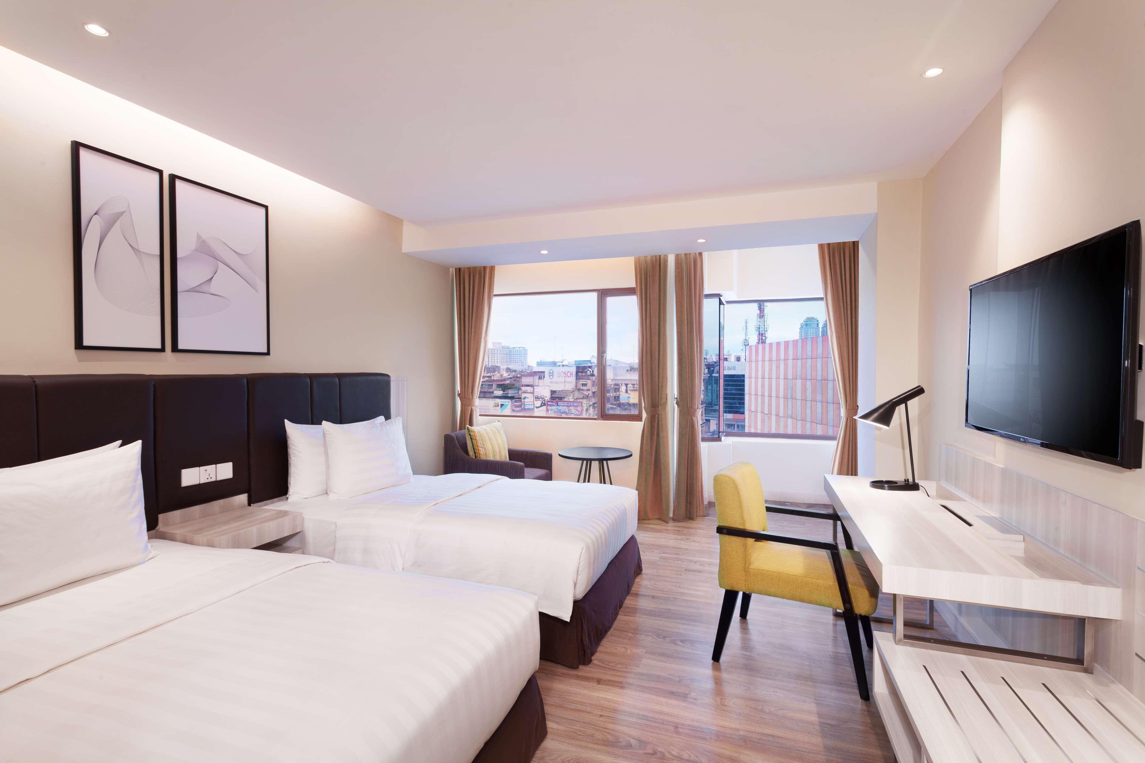 Aiho Hotel Medan Szoba fotó